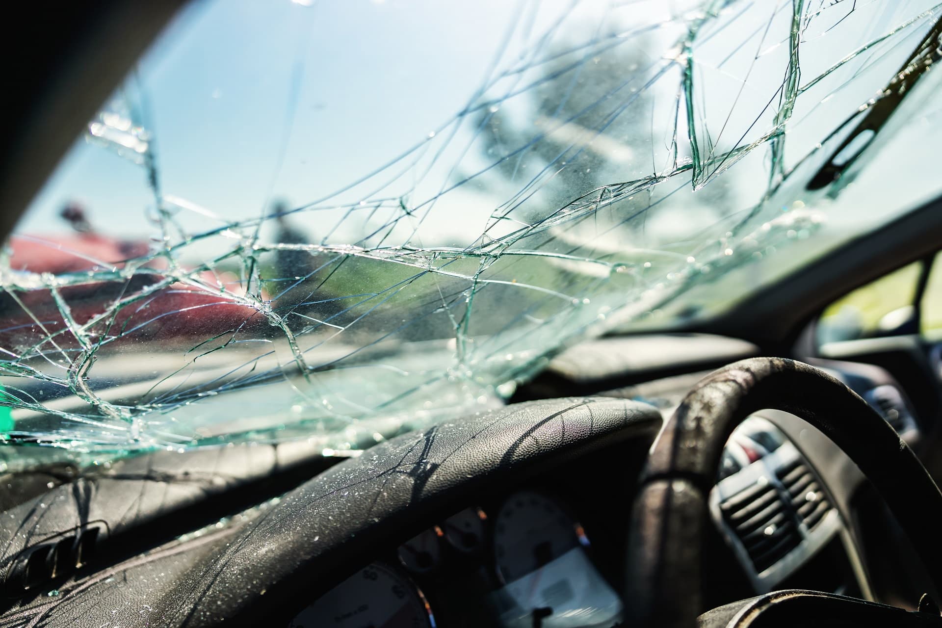 Closeup of crashed car window in car accident.