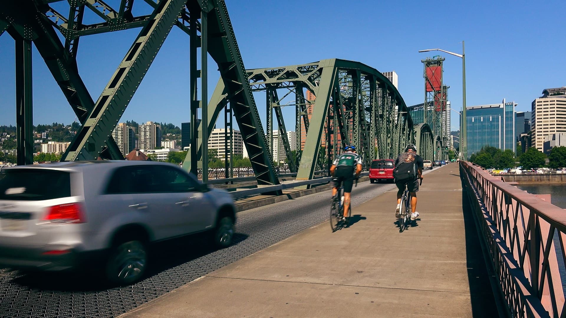 Cyclists  and Cars Cross the Hawthorne Bridge Into Portland, Ore