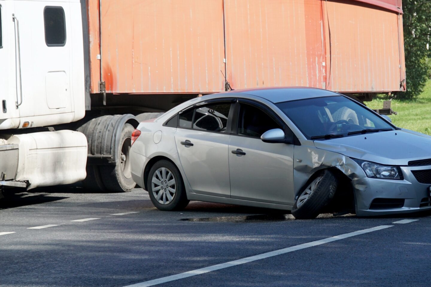 Diesel truck next to a vehicle looks to be an accident