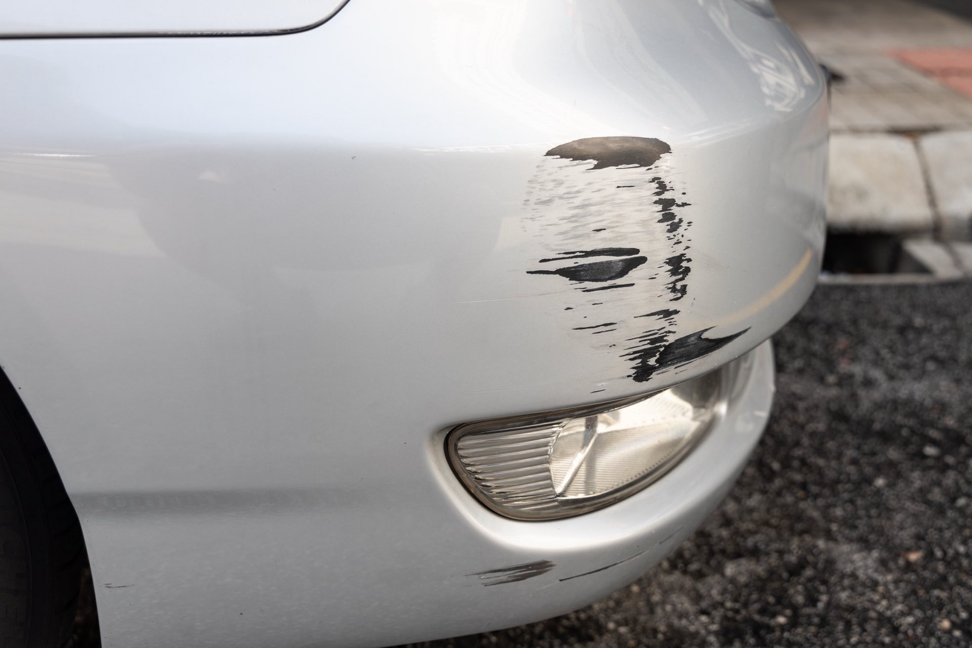 Scratch abrasion on car front bumper