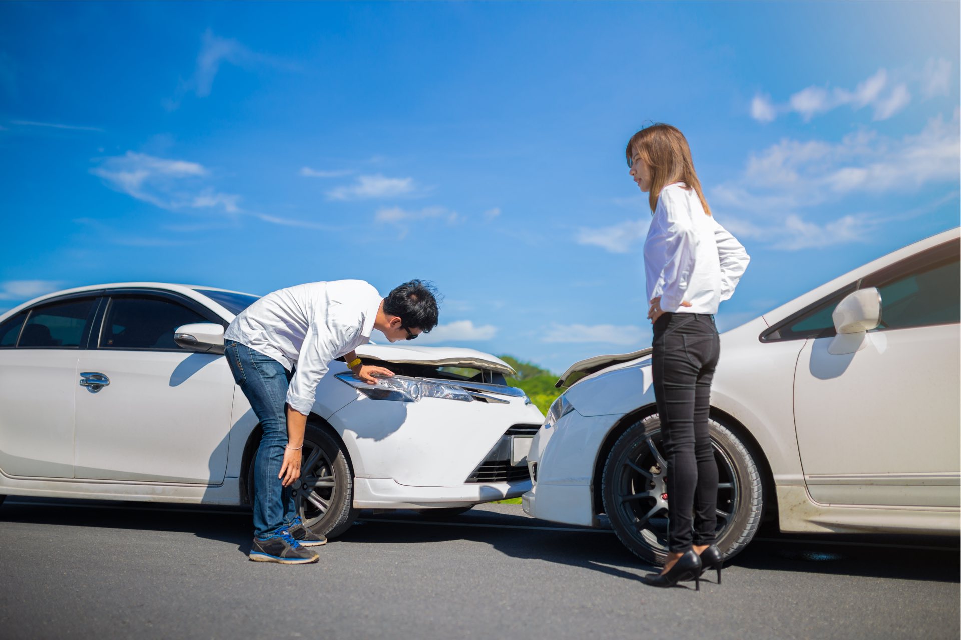 Two Drivers arguing after a car accident on the road