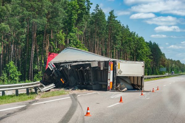 Toy cars in a collision on a signed form | auto accident lawyer​ | Henderson Taylor Law Firm